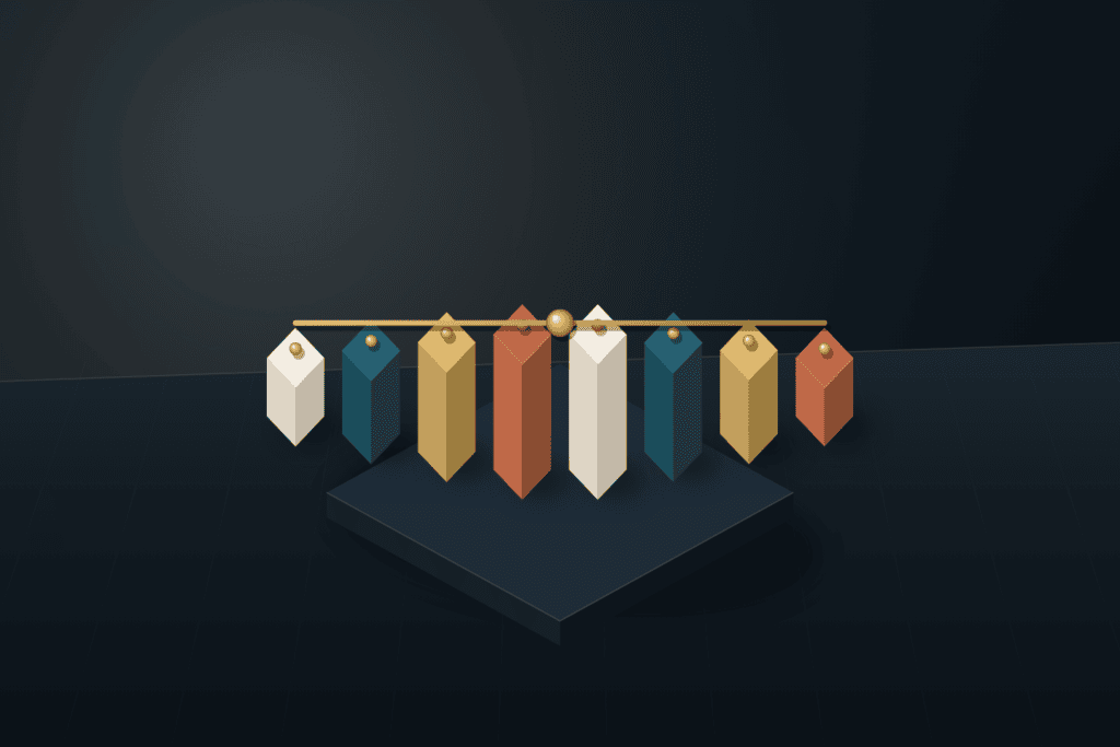 Eight precision architectural blocks aligned across a dark slate studio plinth beneath a brushed brass balance bar