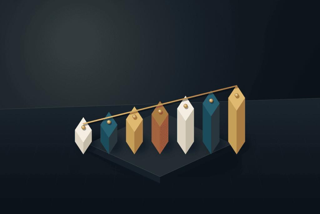 Seven precision architectural blocks arranged in a tiered staircase on a dark slate studio workbench with a brushed brass rod